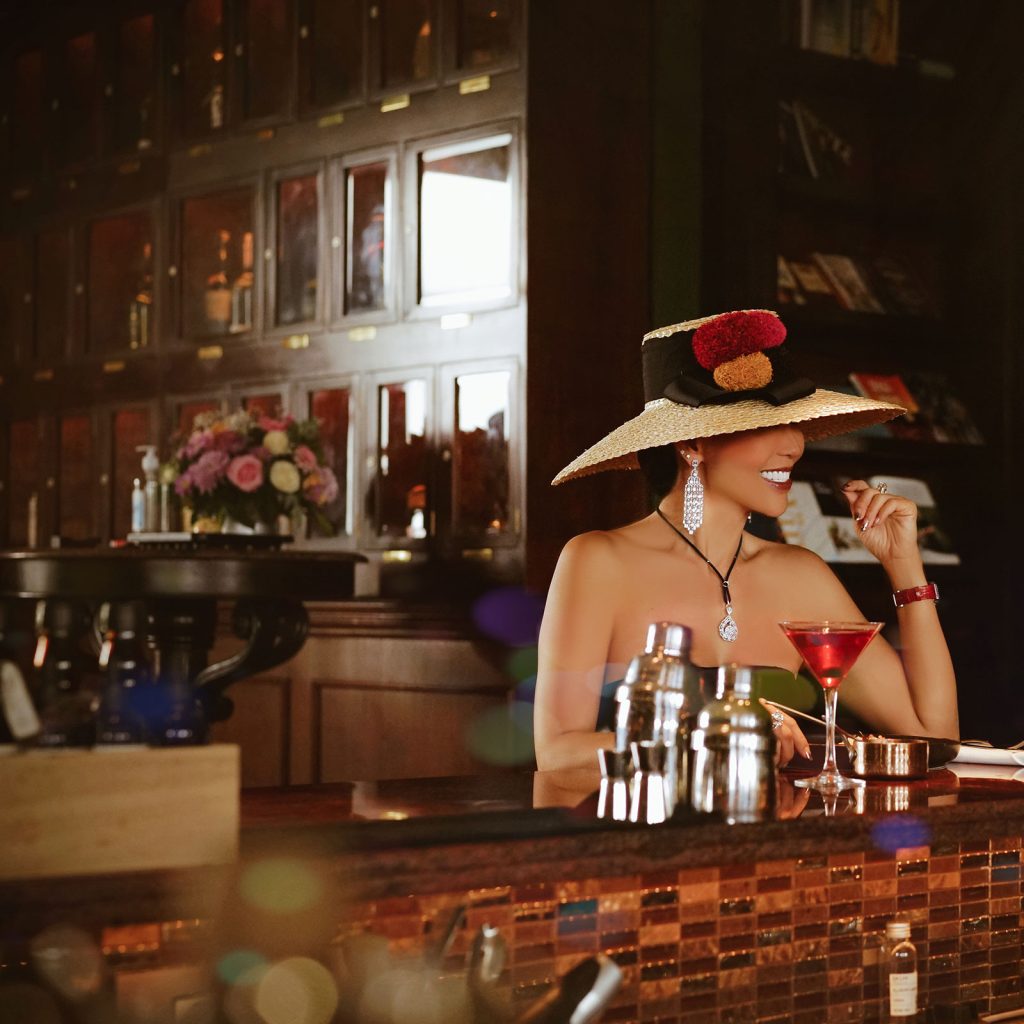 A woman in a photoshoot with a cocktail
