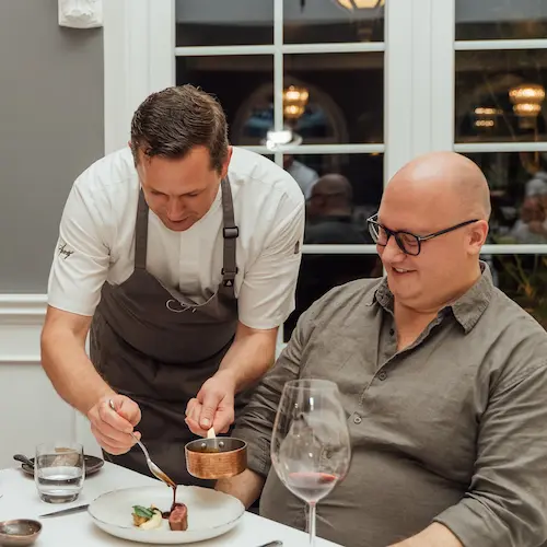 A chef serving a customer
