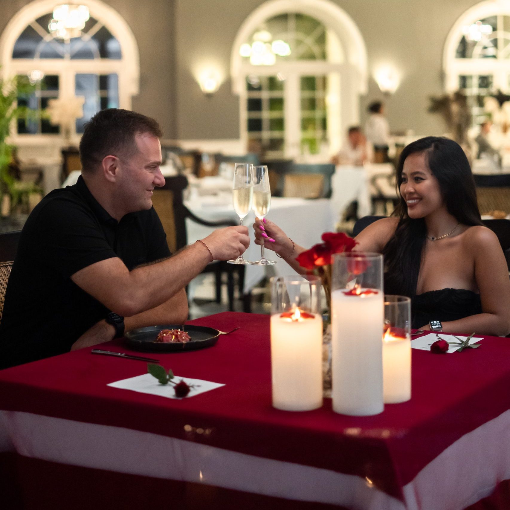 A couple enjoying a candlelight dinner at Aperitif Bali