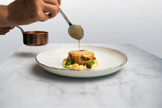 Venison wellington fine dining meal from Apéritif Restaurant