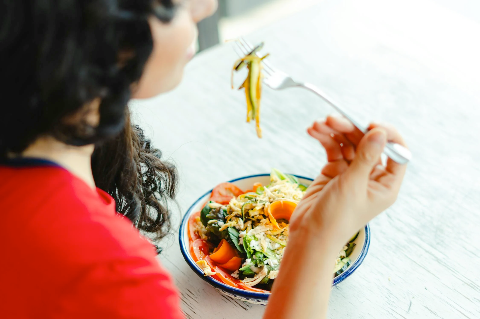 What Is a Michelin Bib Gourmand - Woman Eating