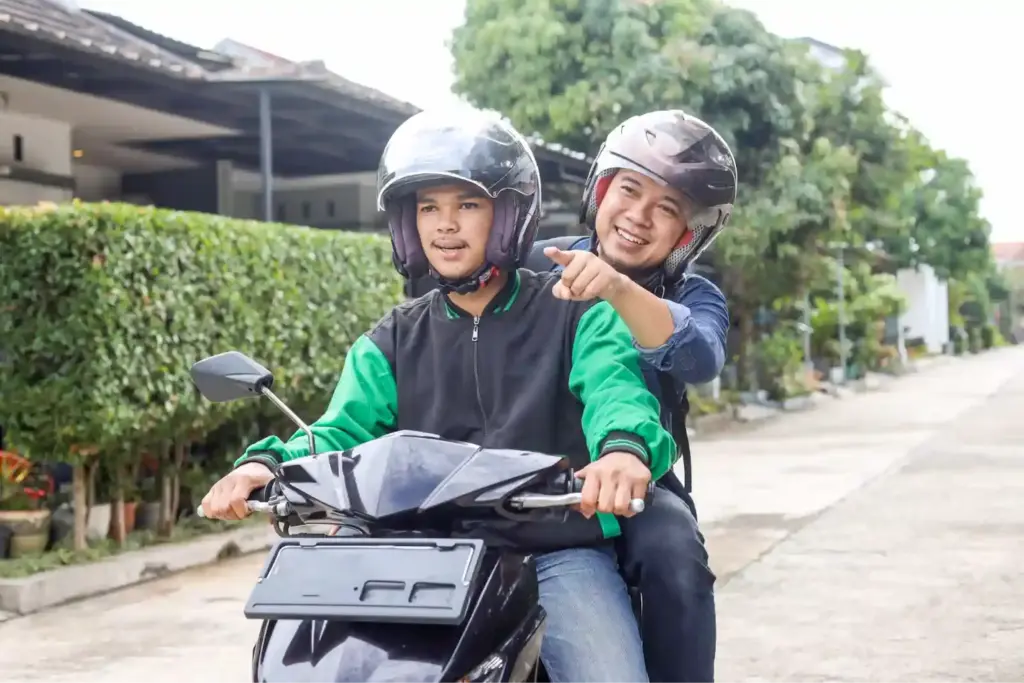 A Gojek driver with passenger