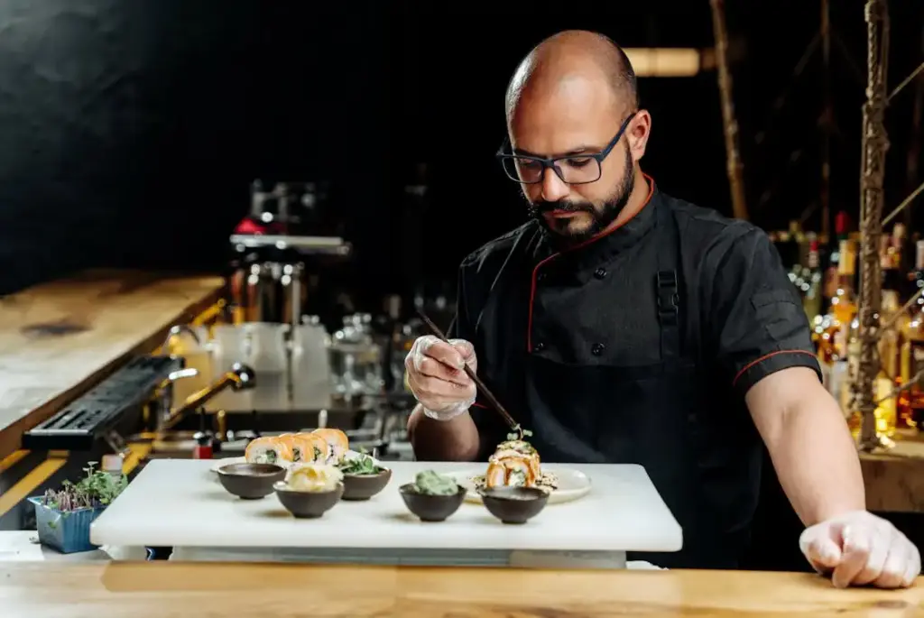 A chef plating Michelin food