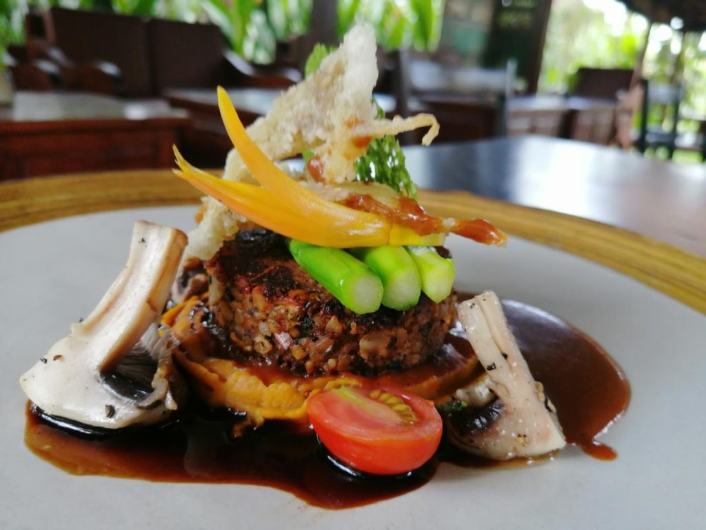 A gluten free main dish plated elegantly from Moksa Ubud