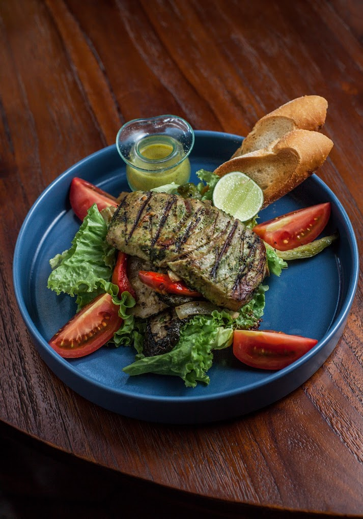 A main meal of grilled tuna and salad from KAFE in Ubud, Bali