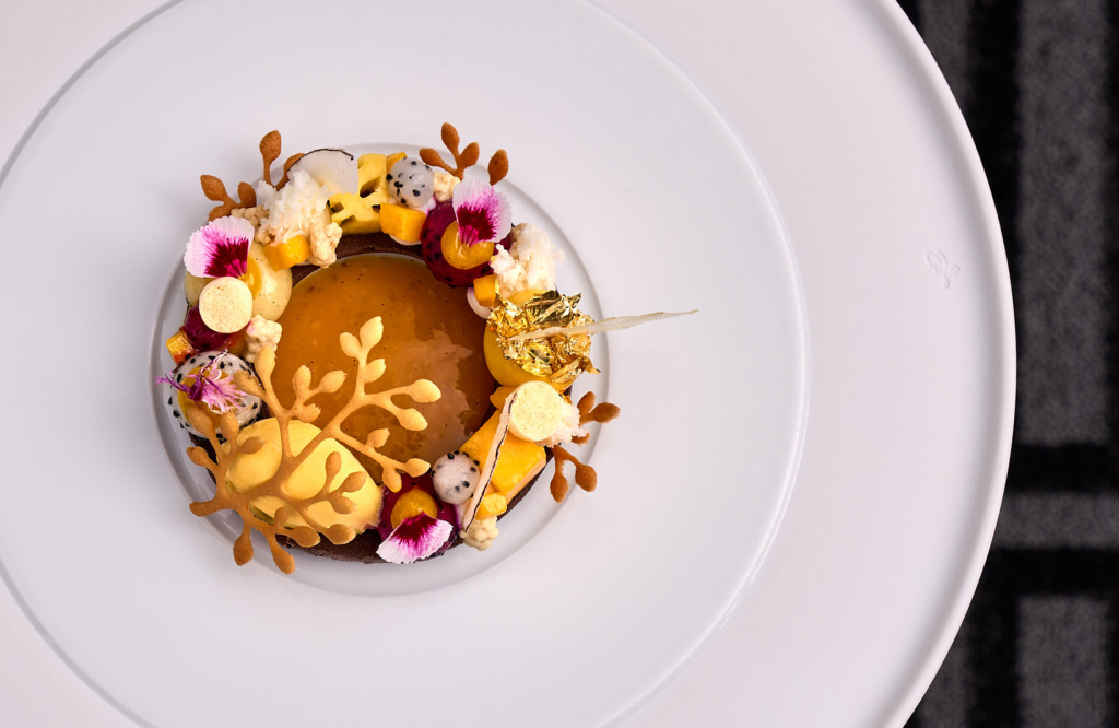A Michelin Star style gourmet dessert, elaborately decorated