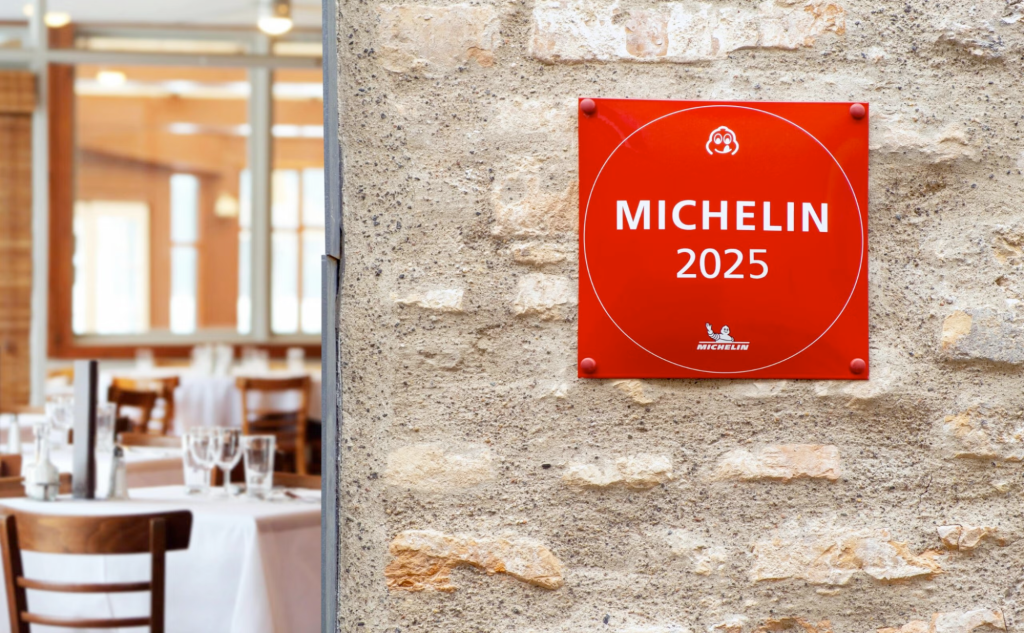 A restaurant with a Michelin sign hung up on a wall