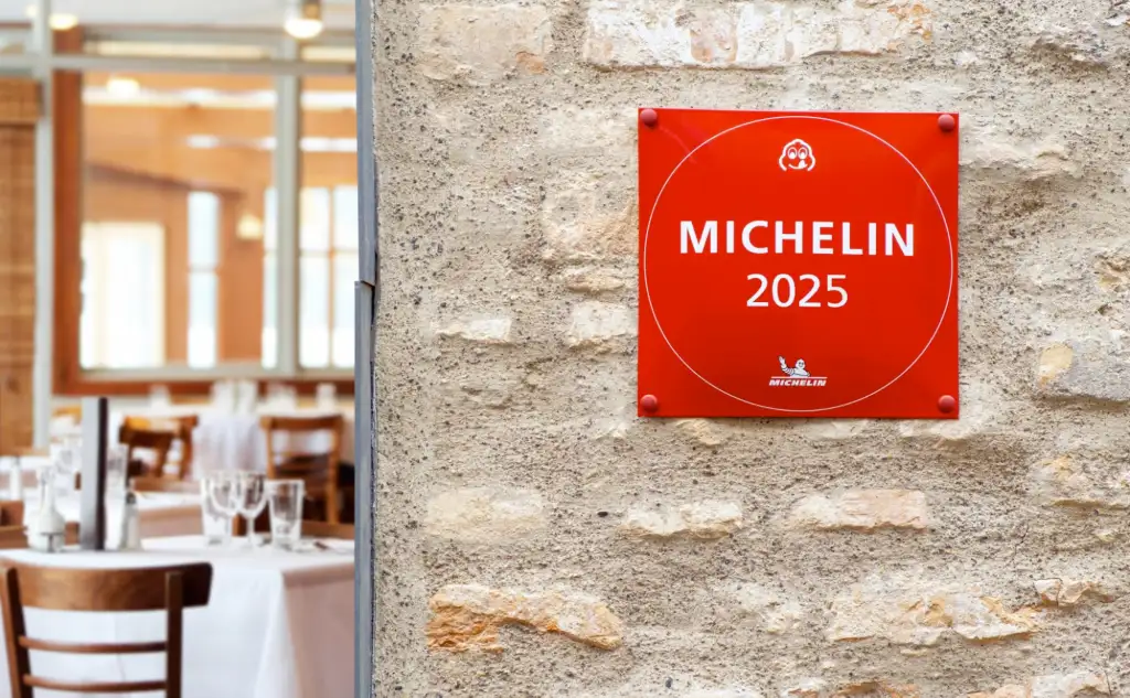 A restaurant with a Michelin sign hung up on a wall