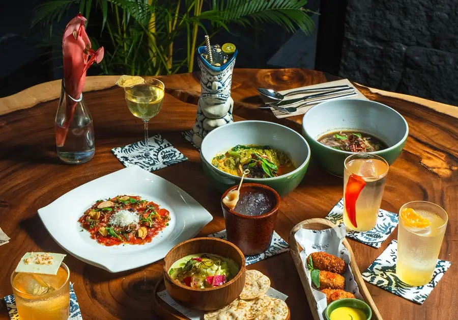 A spread of Indonesian dishes and cocktails from Spice by Black in Ubud, Bali