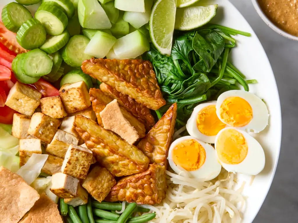 Traditional Indonesian ingrediants like tempeh, tofu, egg and vegetables