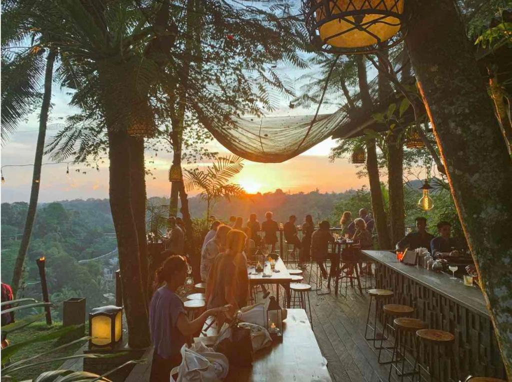 The sun setting over the ridge from the restaurant and bar - Sayan House